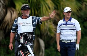 DORAL, FL - MARCH 03: Marcus Fraser of Australia prepares to play his tee shot at the par 3, 13th hole with his caddie Garry Edwards during the first round of the 2016 World Golf Championship Cadillac Championship on the Blue Monster Course at the Trump National Resort on March 3, 2016 in Doral, Florida. (Photo by David Cannon/Getty Images)